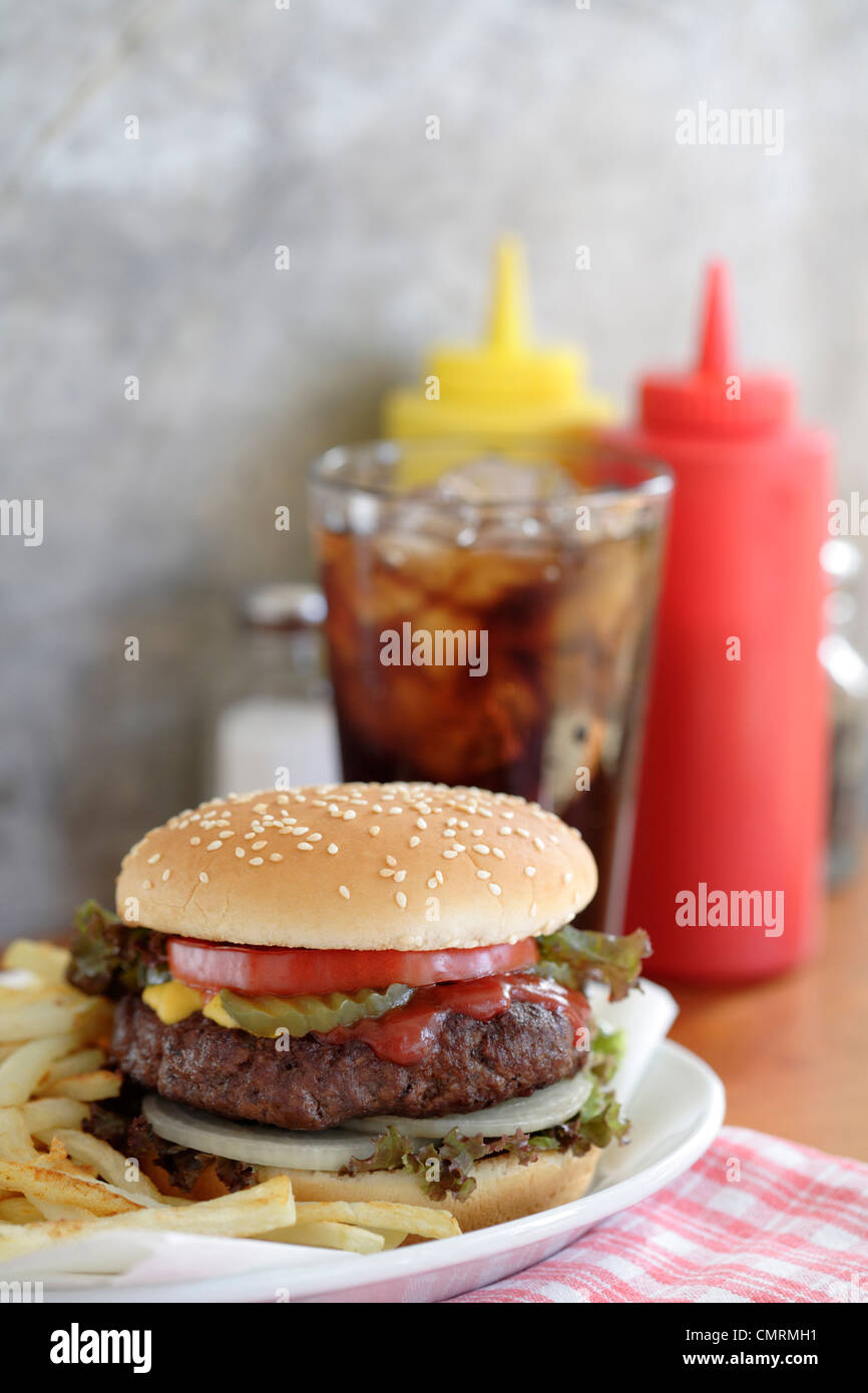 Hamburger and french fries in diner Stock Photo Alamy