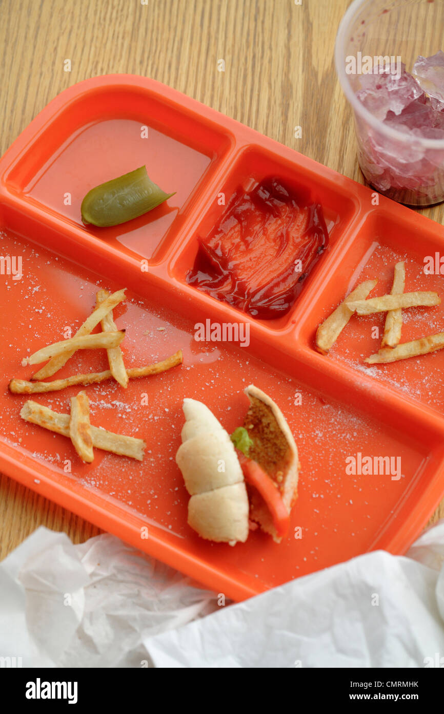 Lunch tray with food remains Stock Photo