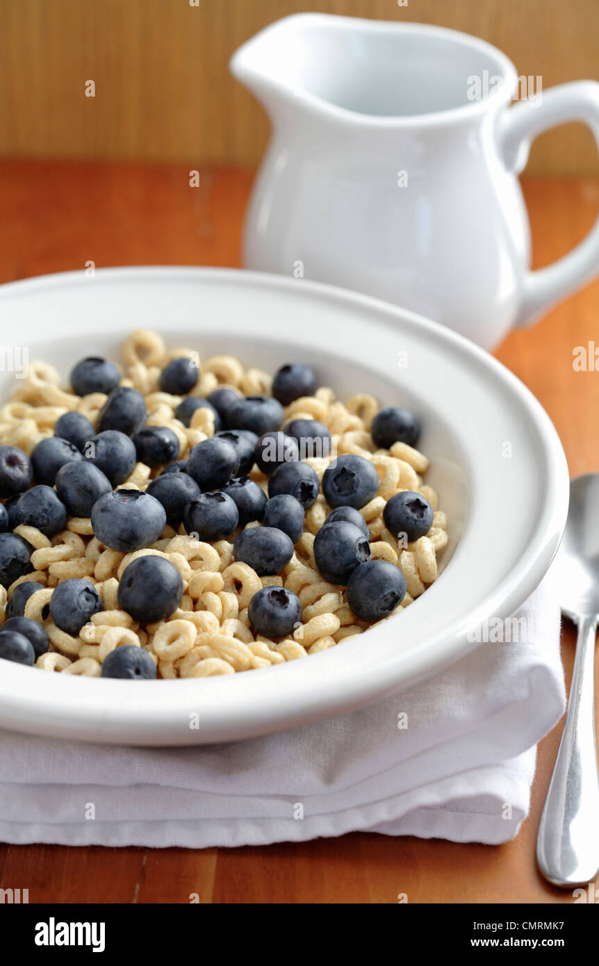 Fresh blueberries in bowl of cereal Stock Photo