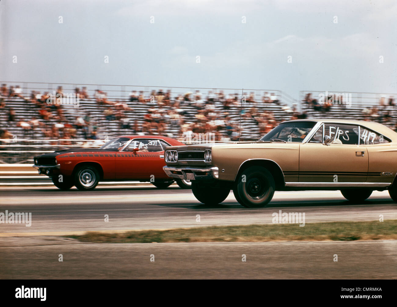 1970 1970s 2 CARS DRAG RACING GRANDSTAND RACE SPEED COMPETITION AUTOMOTIVE BROWNSVILLE INDIANA RACEWAY RETRO Stock Photo