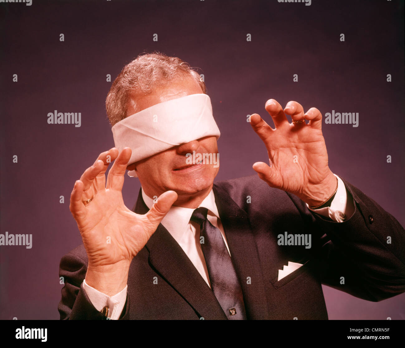 Blindfolded Man Throws Up His Hands Stock Photo, Picture and Royalty Free  Image. Image 7562056.