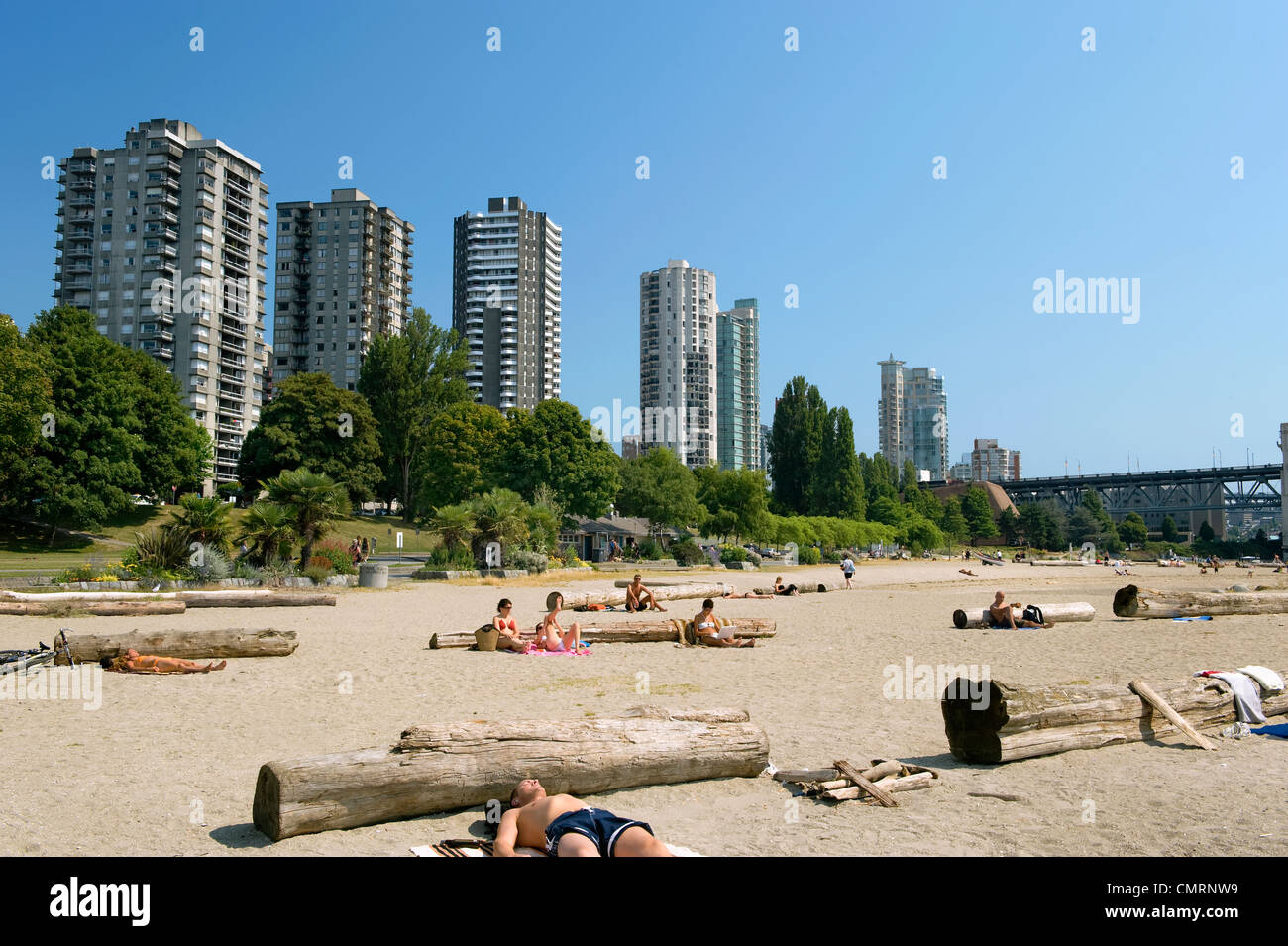 People sun tanning on Sunset Beach, on English Bay, Vancouver, British