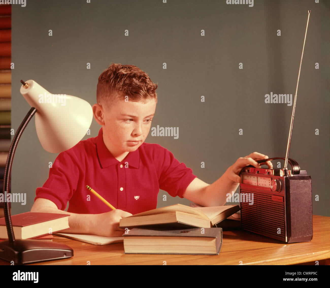 1960 1960s BOY LISTENING RADIO STUDYING STUDY HOMEWORK BOYS LISTEN RADIOS  BOOK BOOKS LAMP SCHOOL CHILDREN CHILD RETRO Stock Photo - Alamy