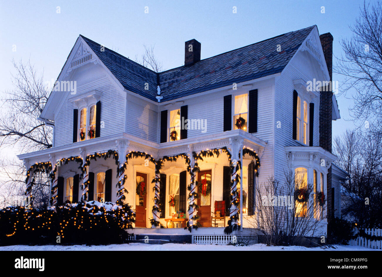 1980s LIGHTED HOUSE WITH CHRISTMAS DECORATIONS Stock Photo - Alamy