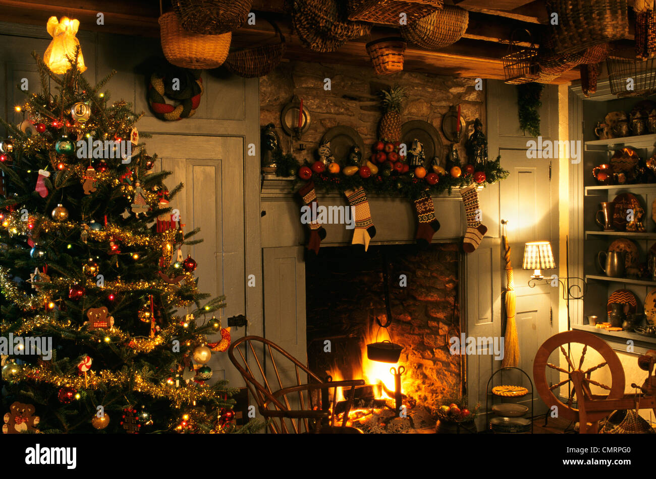 1990s COLONIAL INSPIRED CHRISTMAS TREE AND FIREPLACE Stock Photo ...