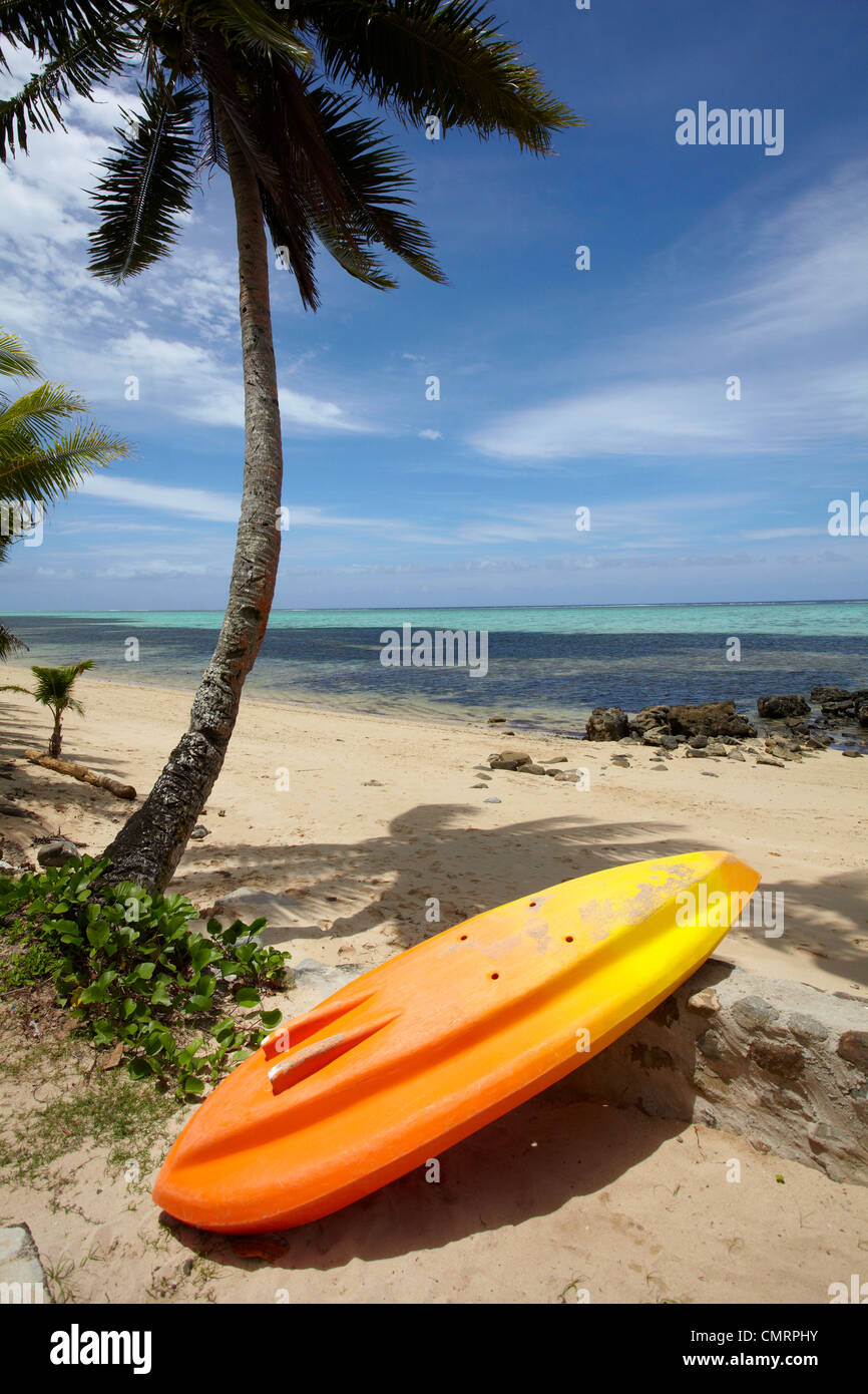 Kayak and palm tree, Crusoe's Retreat, Coral Coast, Viti Levu, Fiji, South Pacific Stock Photo