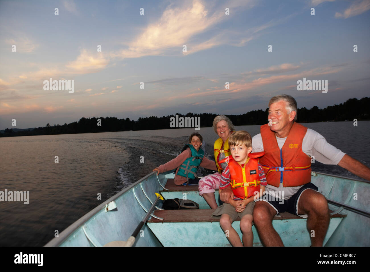 Grandparents and Grandchildren Boating at Sunset, Barry's Bay, Ontario Stock Photo