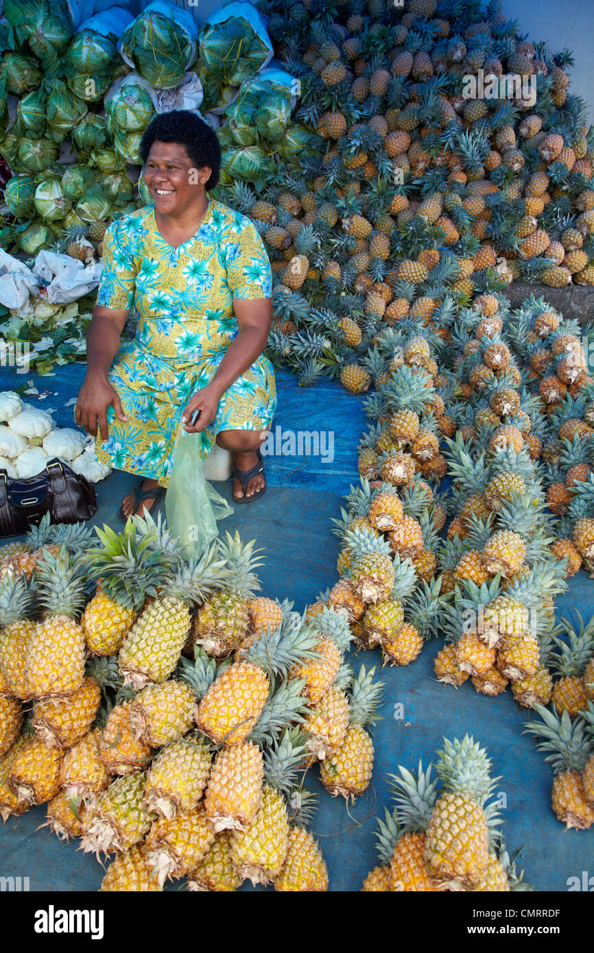 Fijian lady and pineapple stall at Suva Municipal Market, Suva, Viti Levu, Fiji, South Pacific