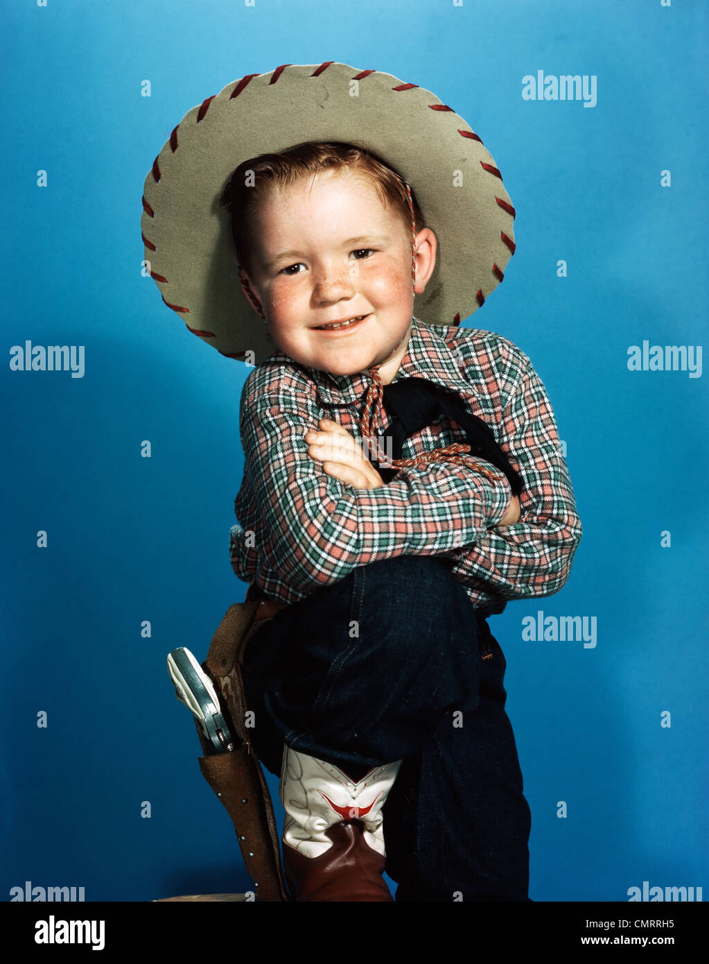 1940s PORTRAIT SMILING BOY WEARING COWBOY HAT LEATHER BOOTS HOLSTER TOY GUN  Stock Photo - Alamy