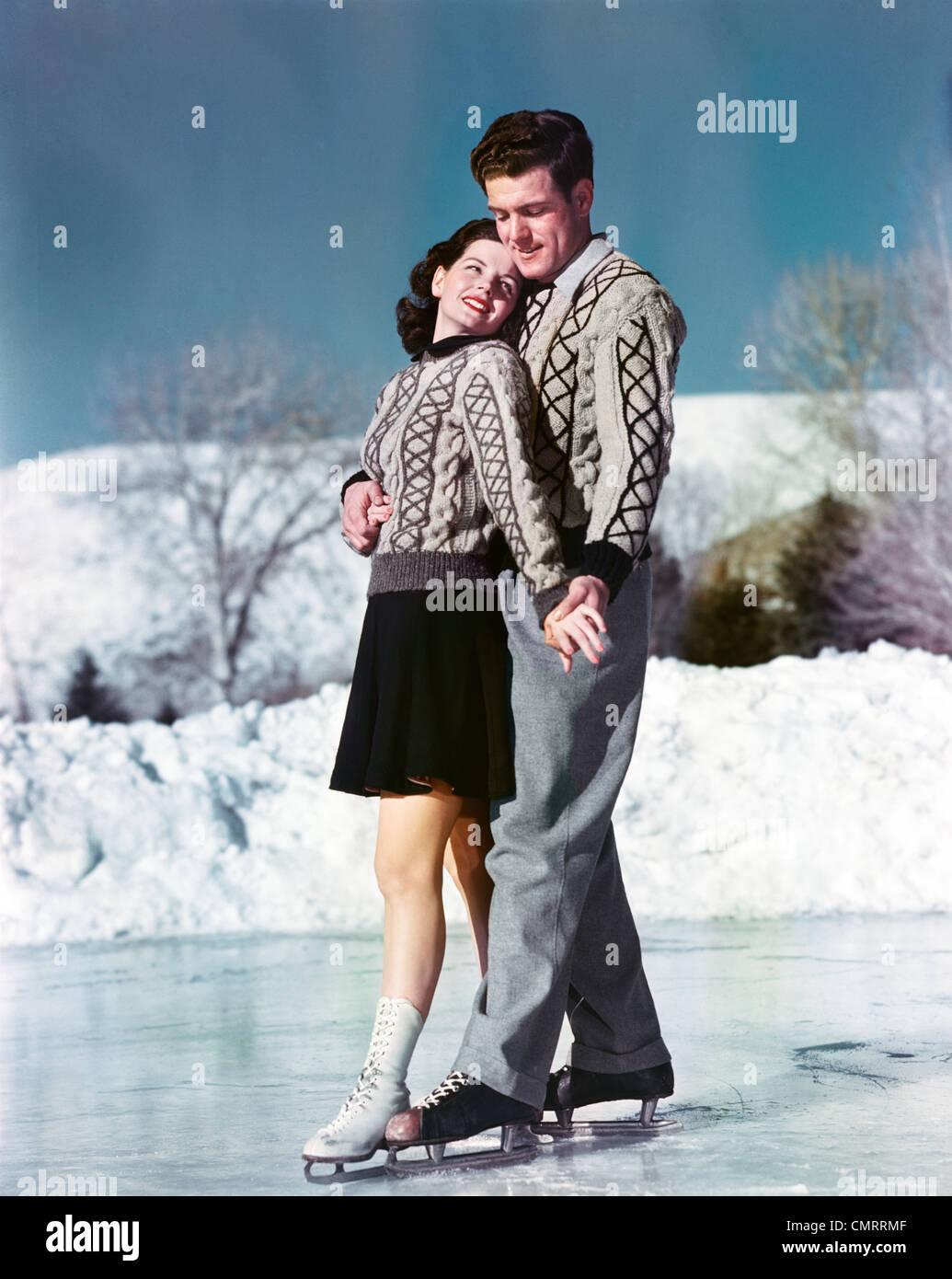 1940s 1950s SMILING COUPLE ICE SKATING WEARING MATCHING ...