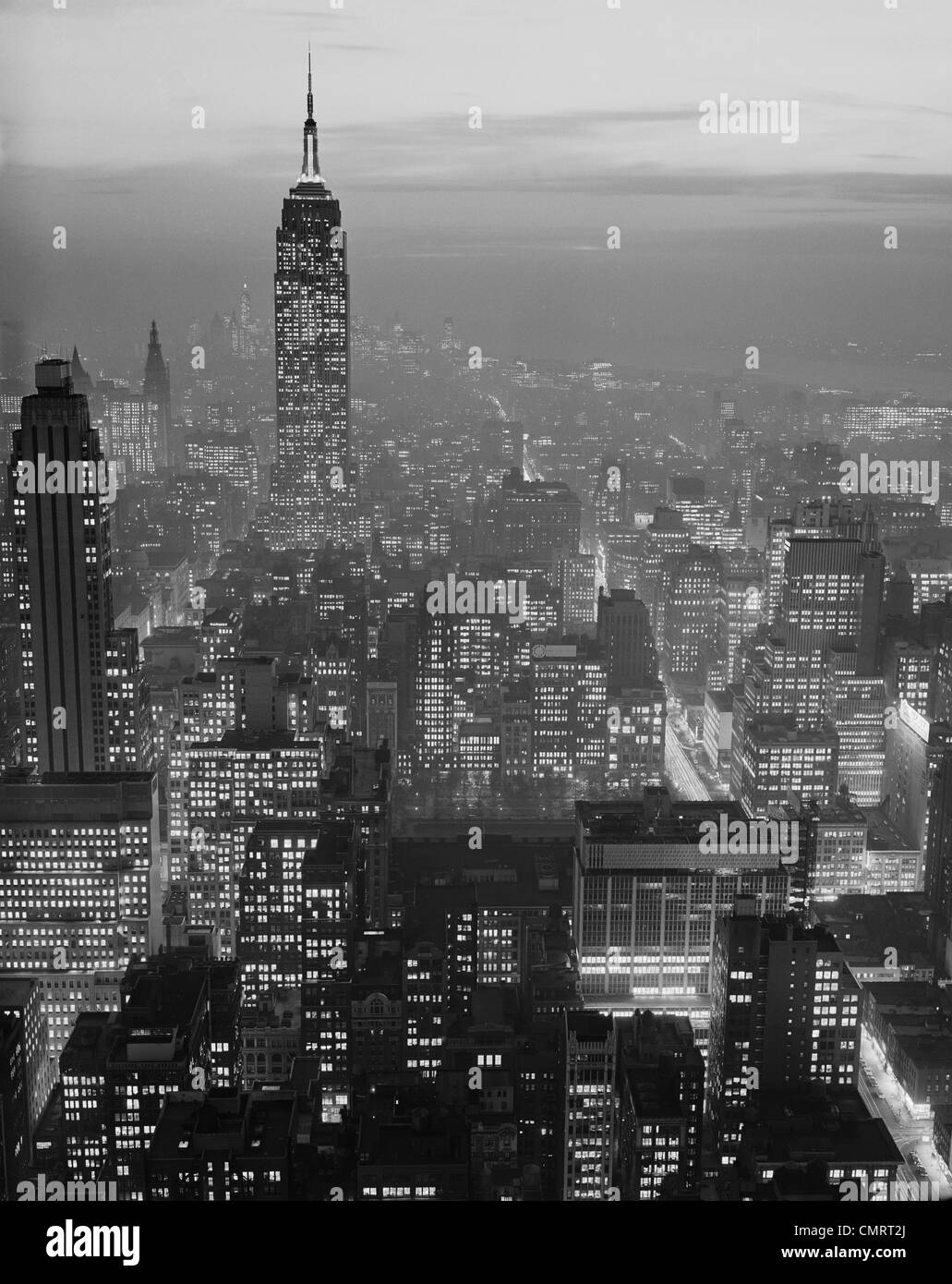 1960s NIGHT VIEW MANHATTAN EMPIRE STATE BUILDING LOOKING SOUTH FROM MIDTOWN Stock Photo