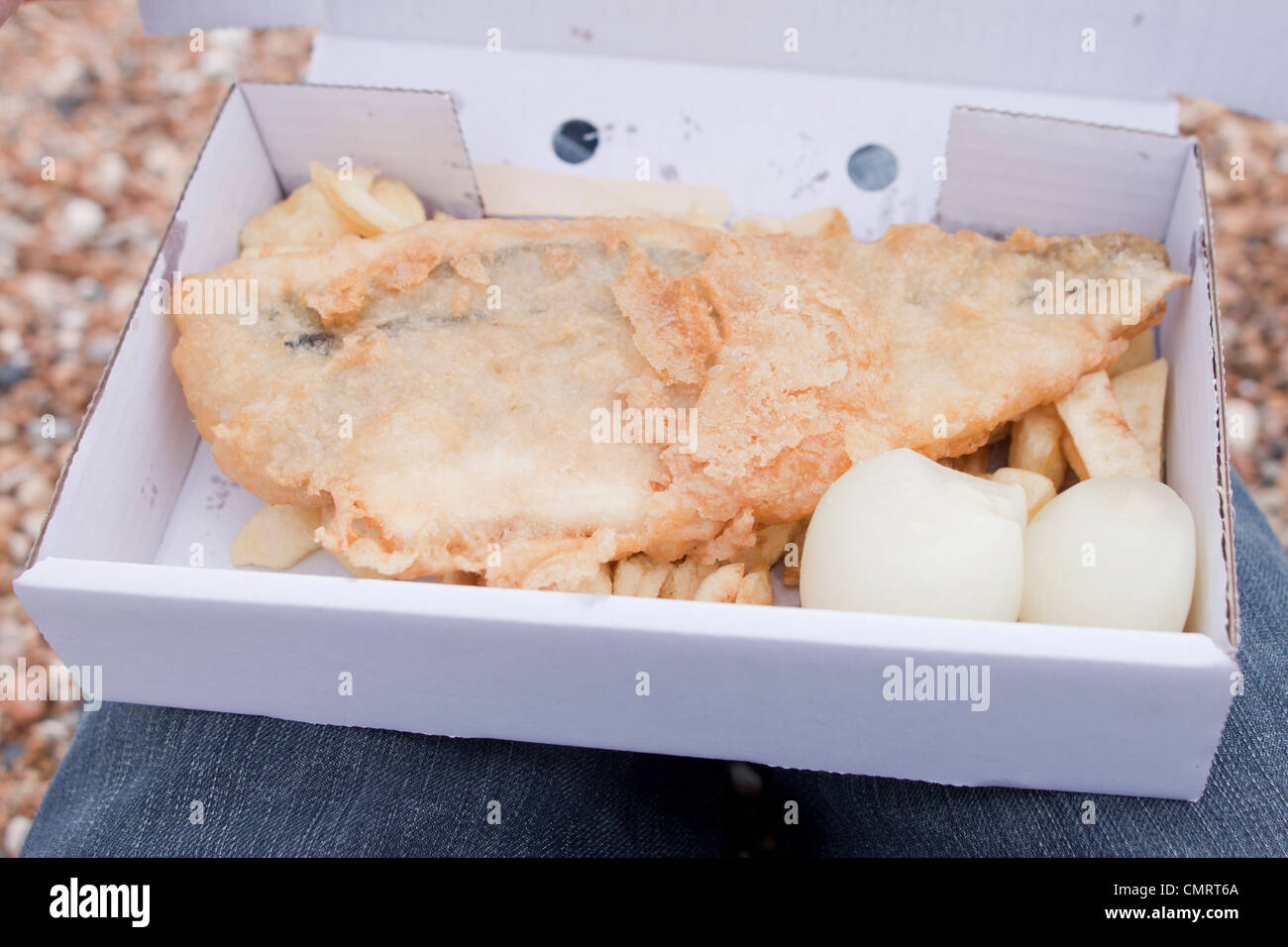 Eating fish and chips along the Brighton seaside, England, UK Stock