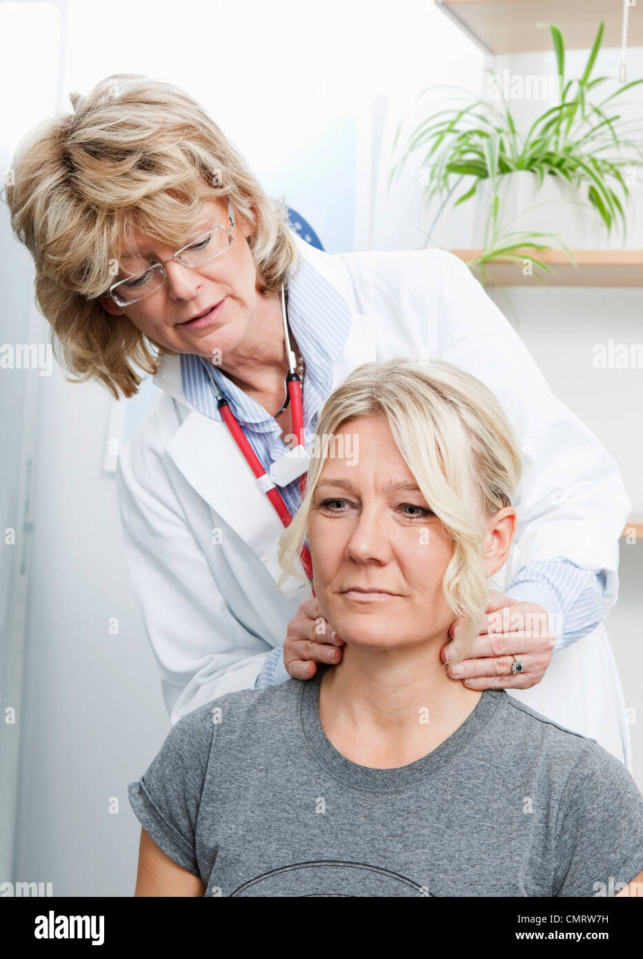 Doctor helping patient Stock Photo - Alamy