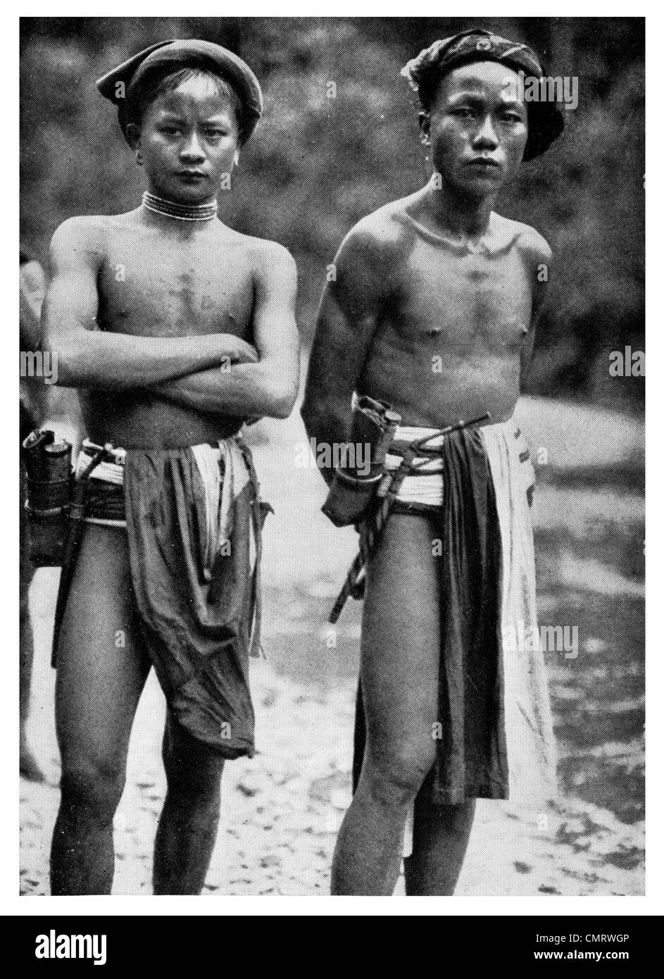 1919 Land dyak men of Sarawak Bamboo boxes with tobacco  Borneo Malaysia Stock Photo