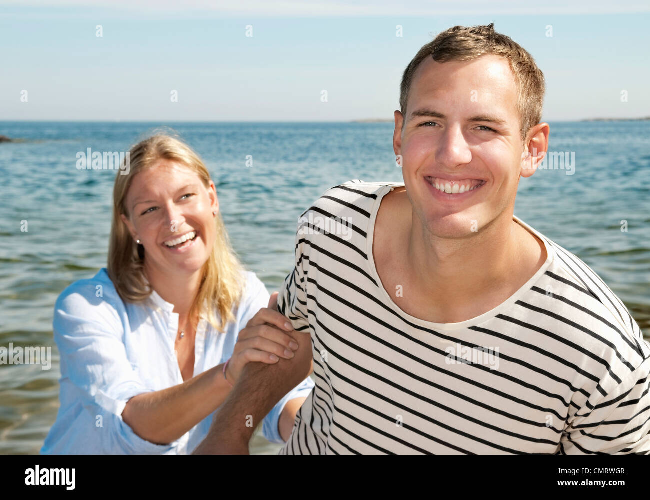 Two people playing on the beach