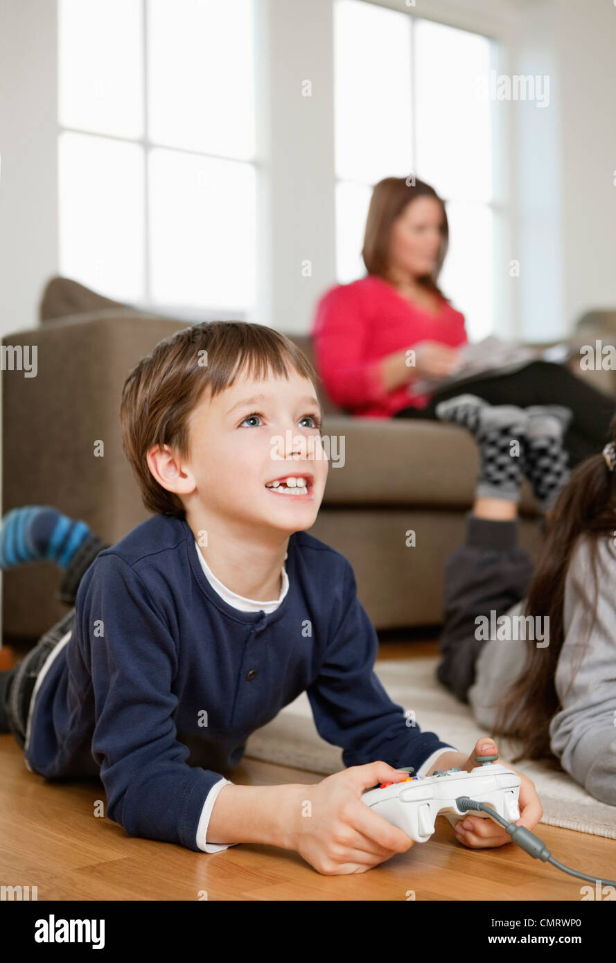 Kids in front of videogames Stock Photo