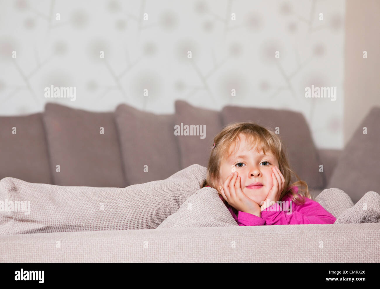Girl in couch Stock Photo