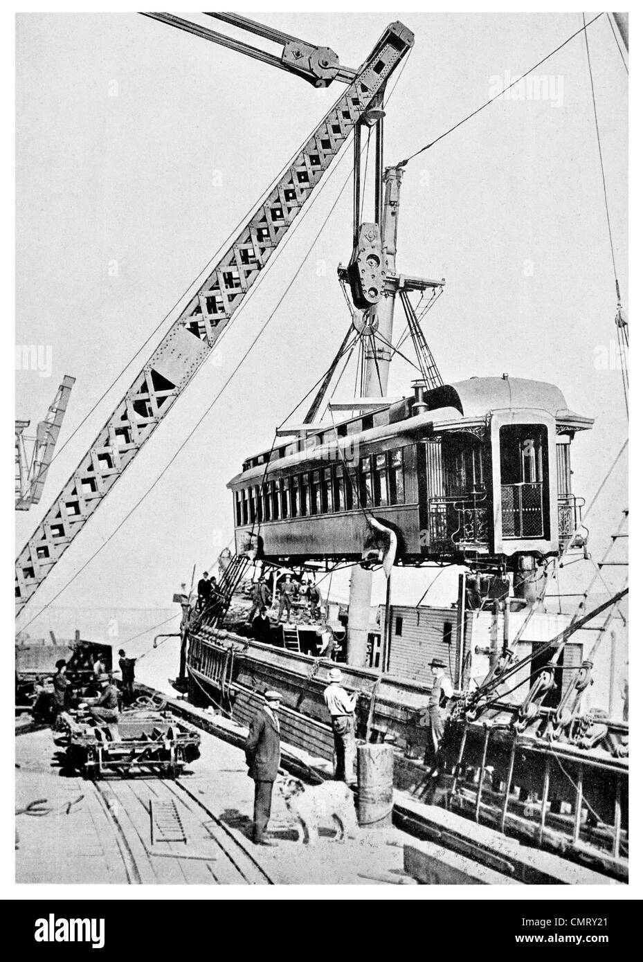 1923 Loading a passenger carriage at Seattle for shipment to Alaska railway train Stock Photo
