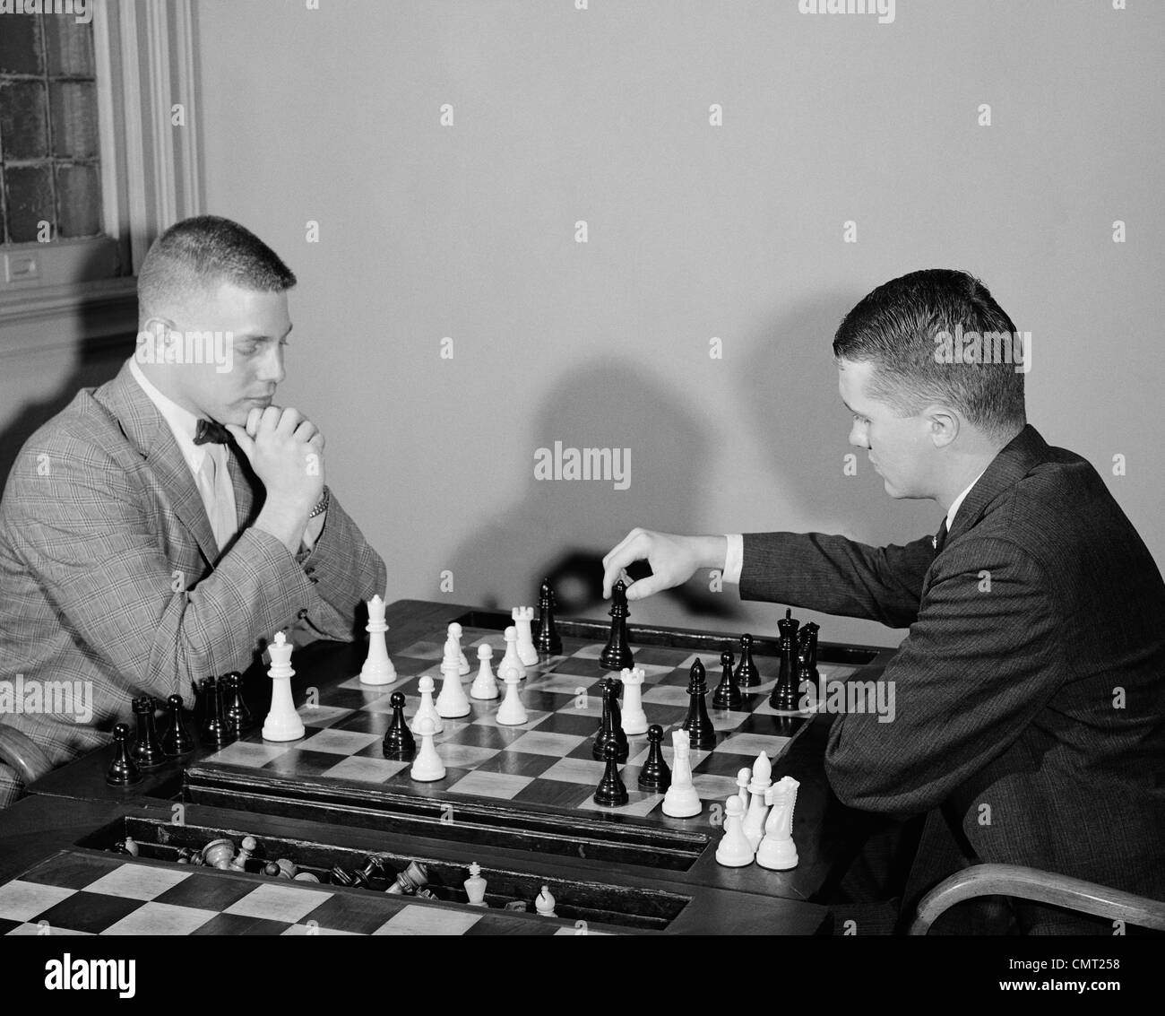 1960s TWO MEN PLAYING CHESS GAME Stock Photo