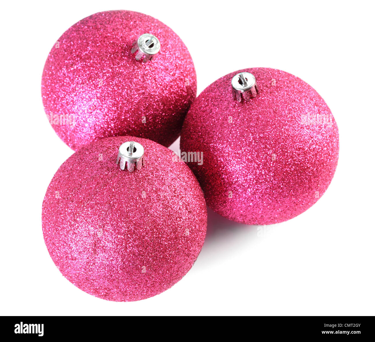 Top view of three red Christmas tree balls isolated on white, focus on ...