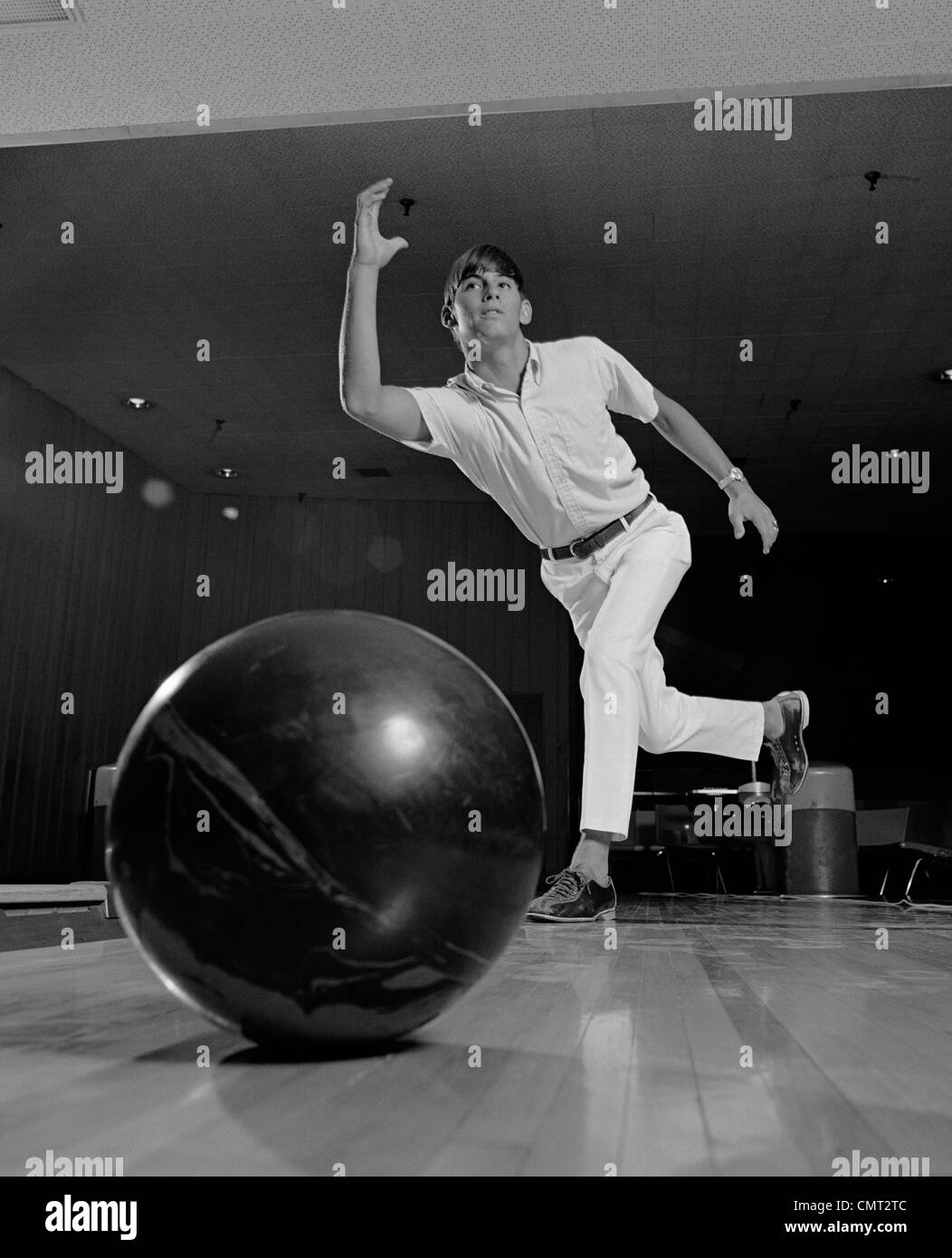 1970s YOUNG MAN HAVING JUST THROWN A BOWLING BALL Stock Photo Alamy