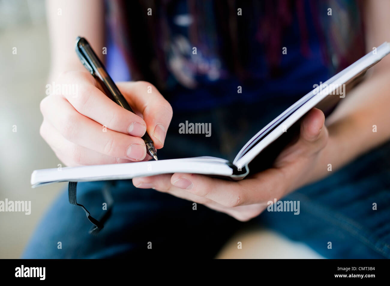Young woman doing her school work Stock Photo