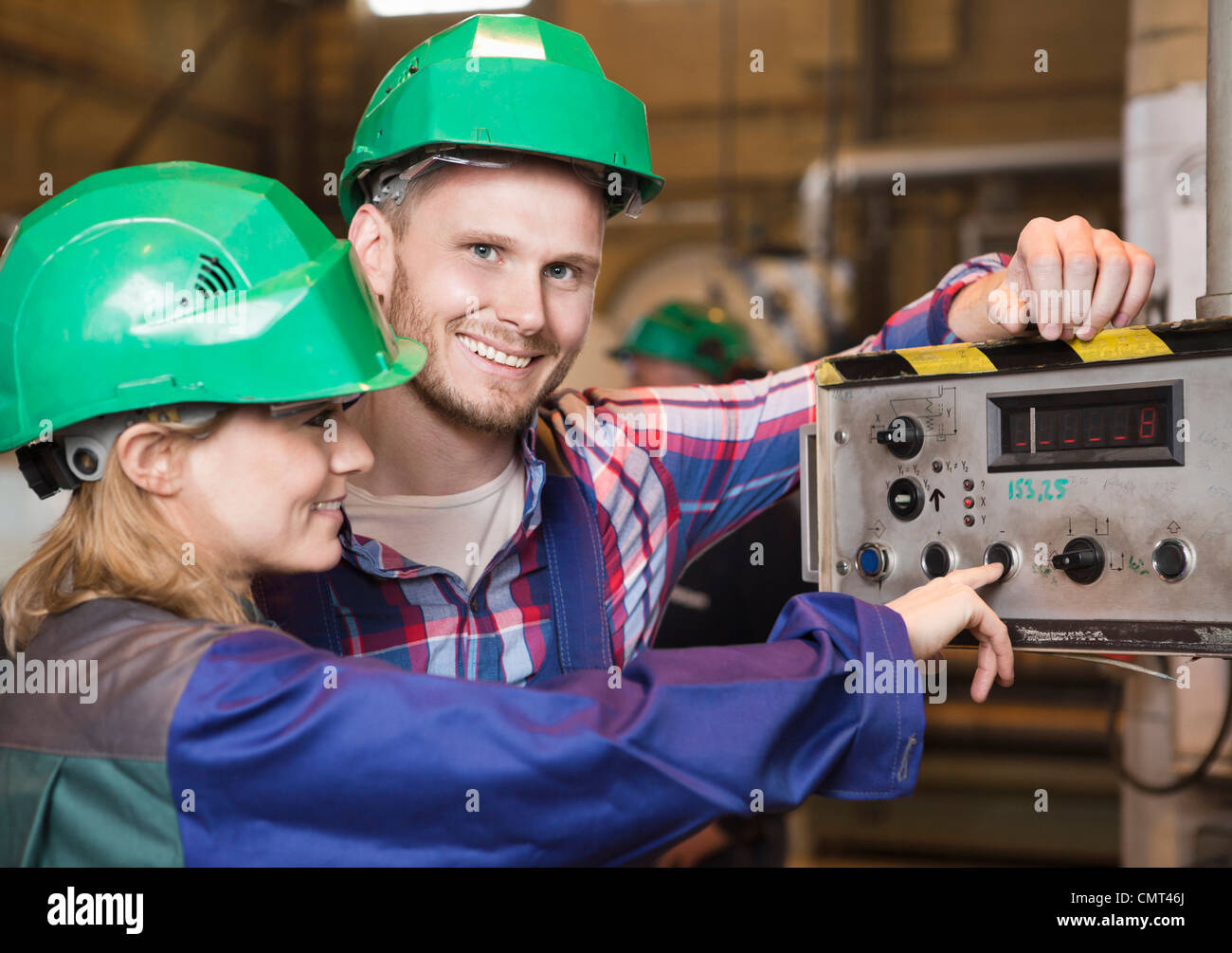 Woman and man in helmets Stock Photo - Alamy