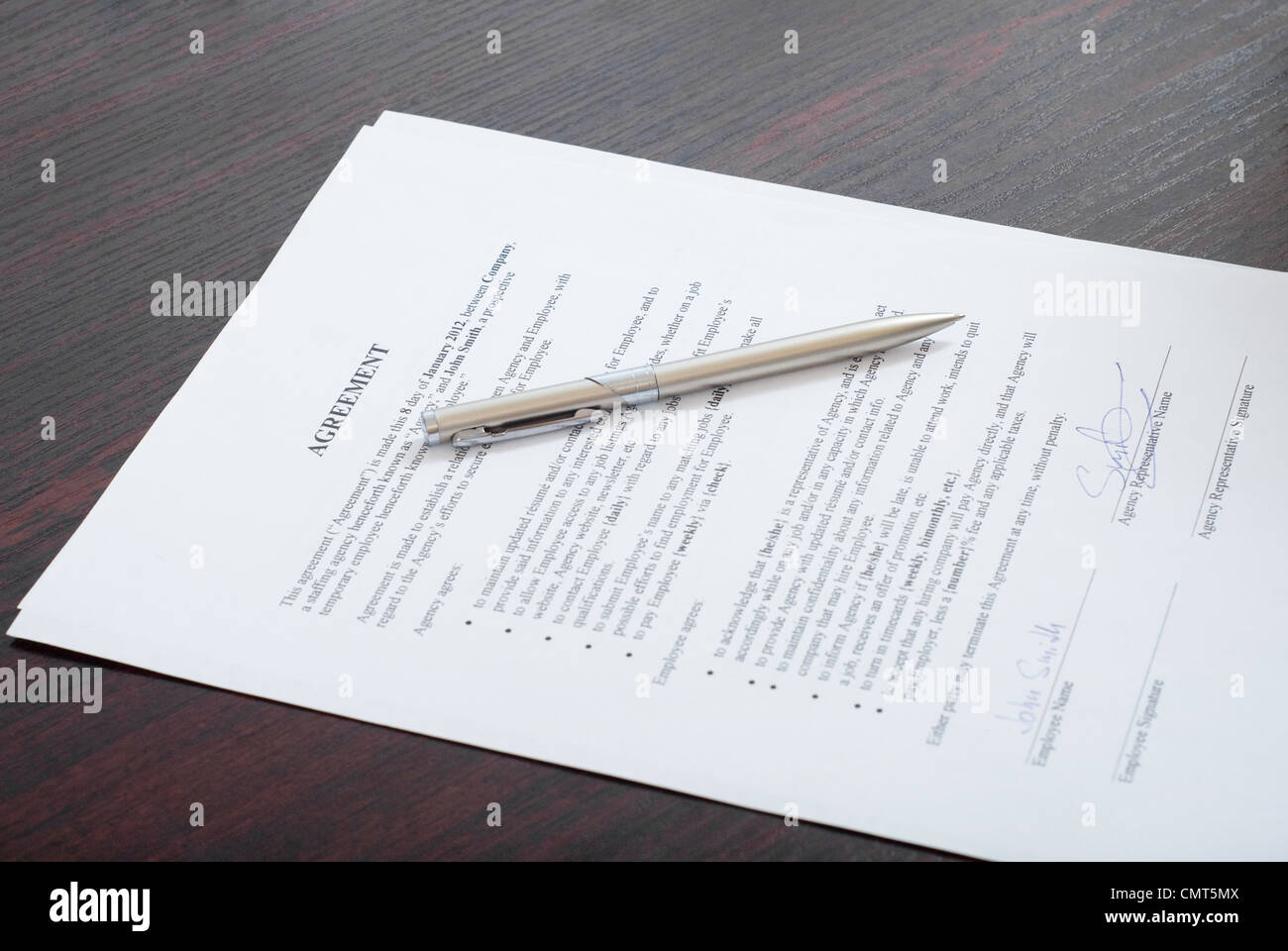 Contract with silver pen on the table Stock Photo