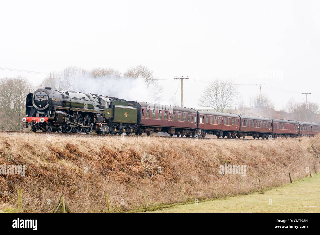 Steam locomotive pulling a passenger train on the East Lancs Railway at Burrs Country park Stock Photo