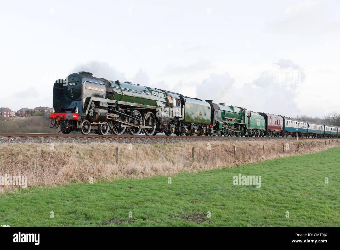 Steam locomotive pulling a passenger train on the East Lancs Railway at  Burrs Country park Stock Photo