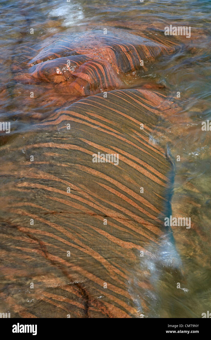 Close-up of colourful striped rocks in water, Georgian Bay, Ontario, Canada Stock Photo