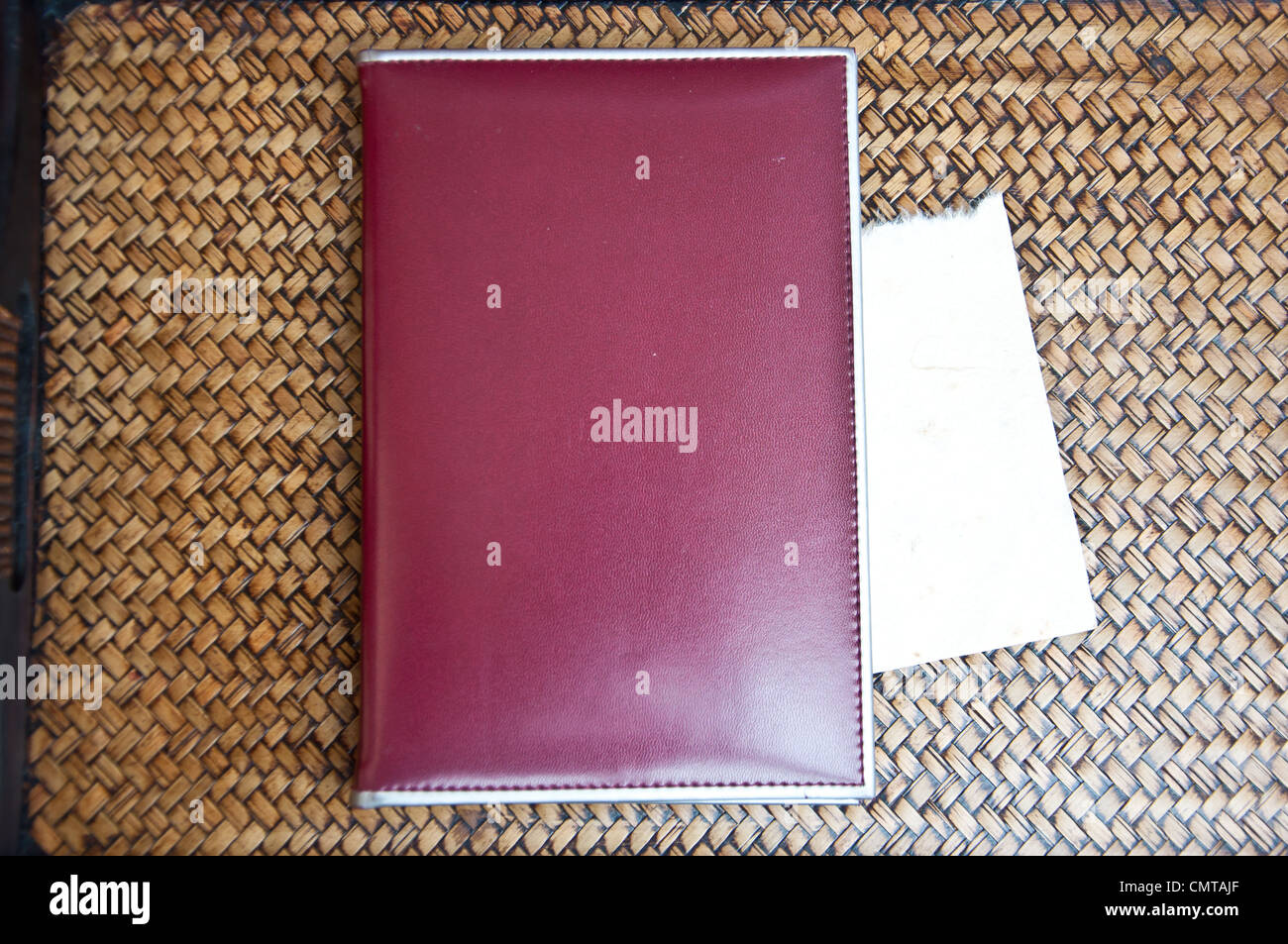 Brown notebook and blank paper on sedge background Stock Photo
