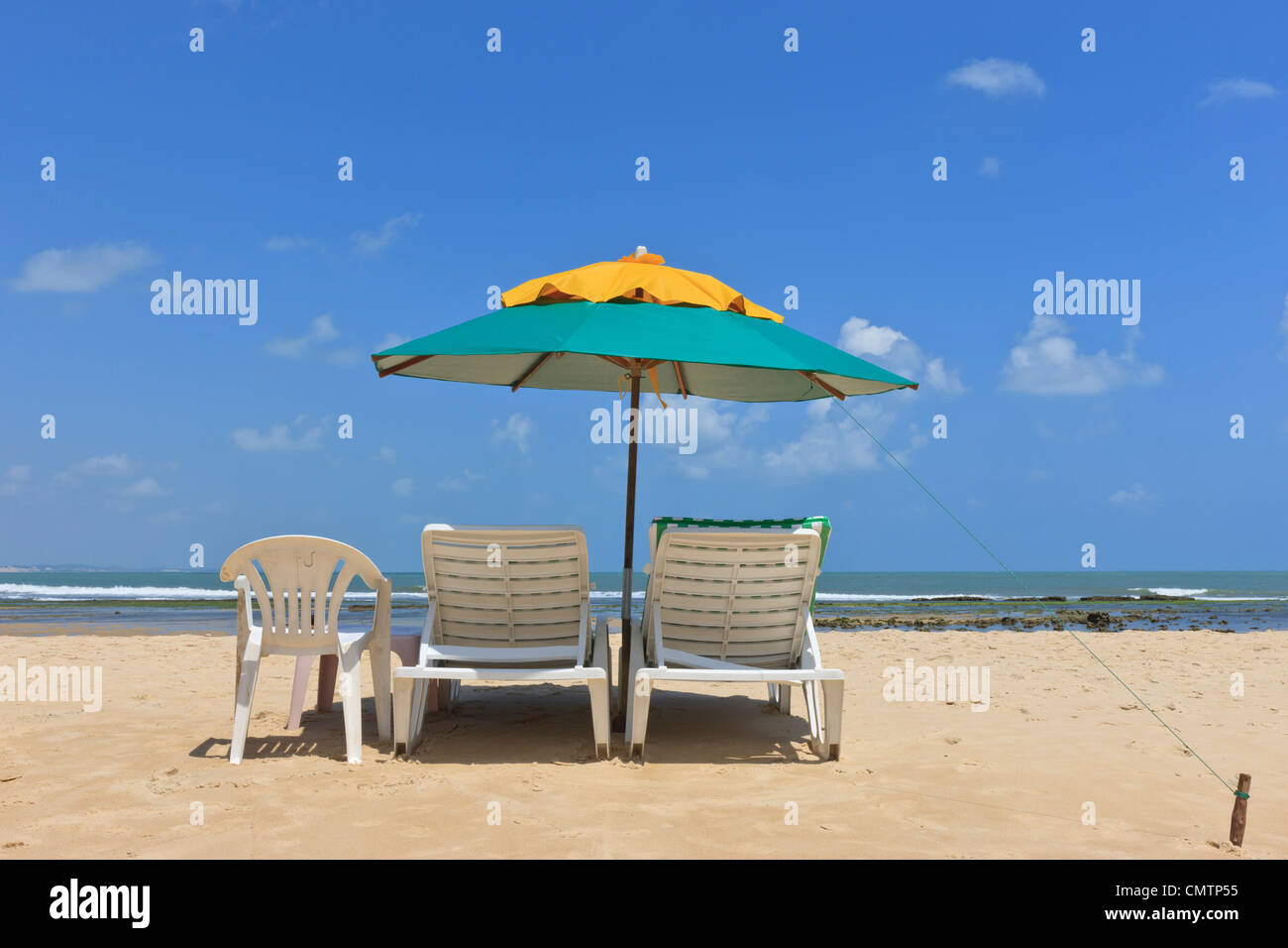 parasol, umbrella, sunshade, sun umbrella with beach chairs on beach Stock Photo