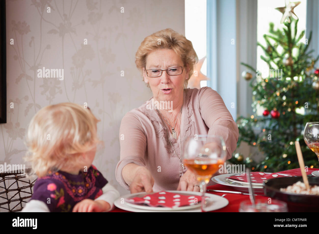 Two people on dinner table Stock Photo