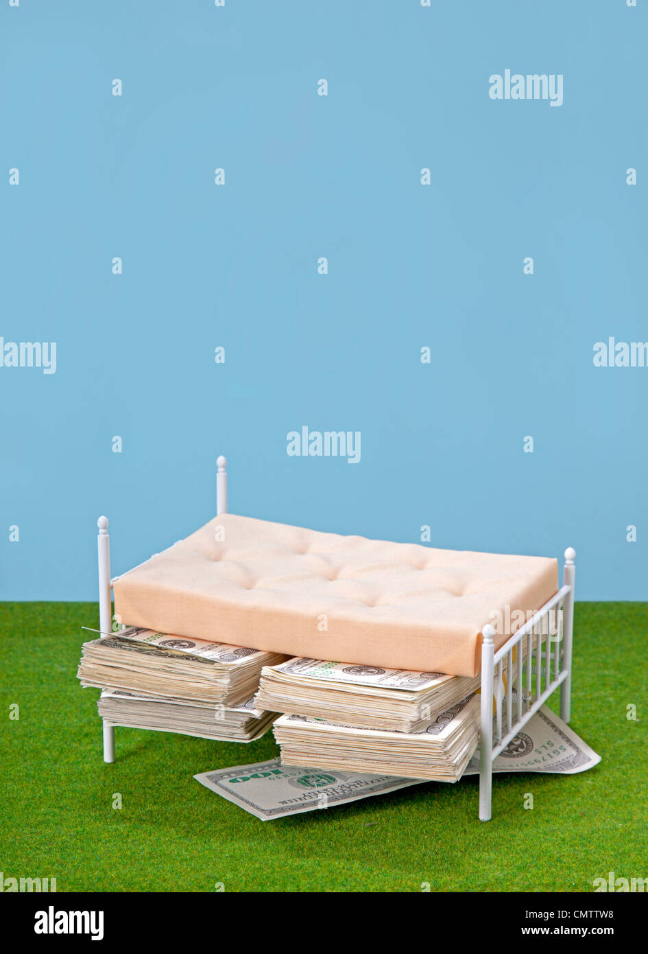 bed with money under mattress Stock Photo Alamy