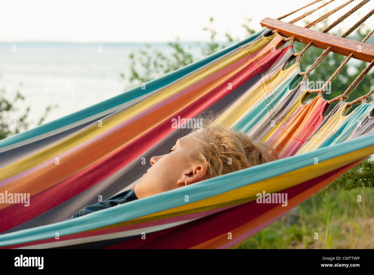 Woman sleeping in hammock Stock Photo