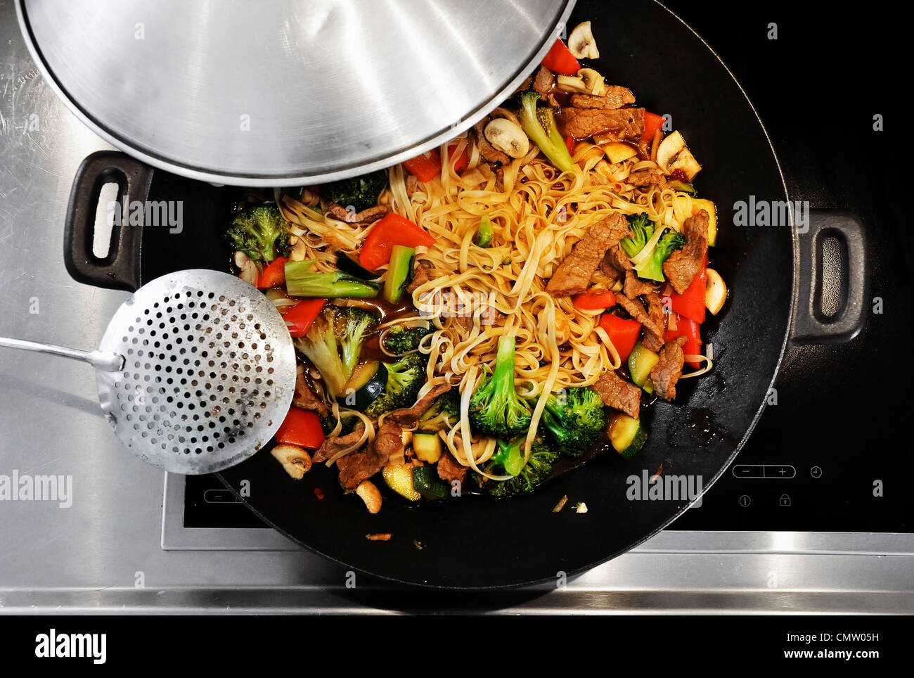 Cooking vegetable stirfry in a wok Stock Photo Alamy
