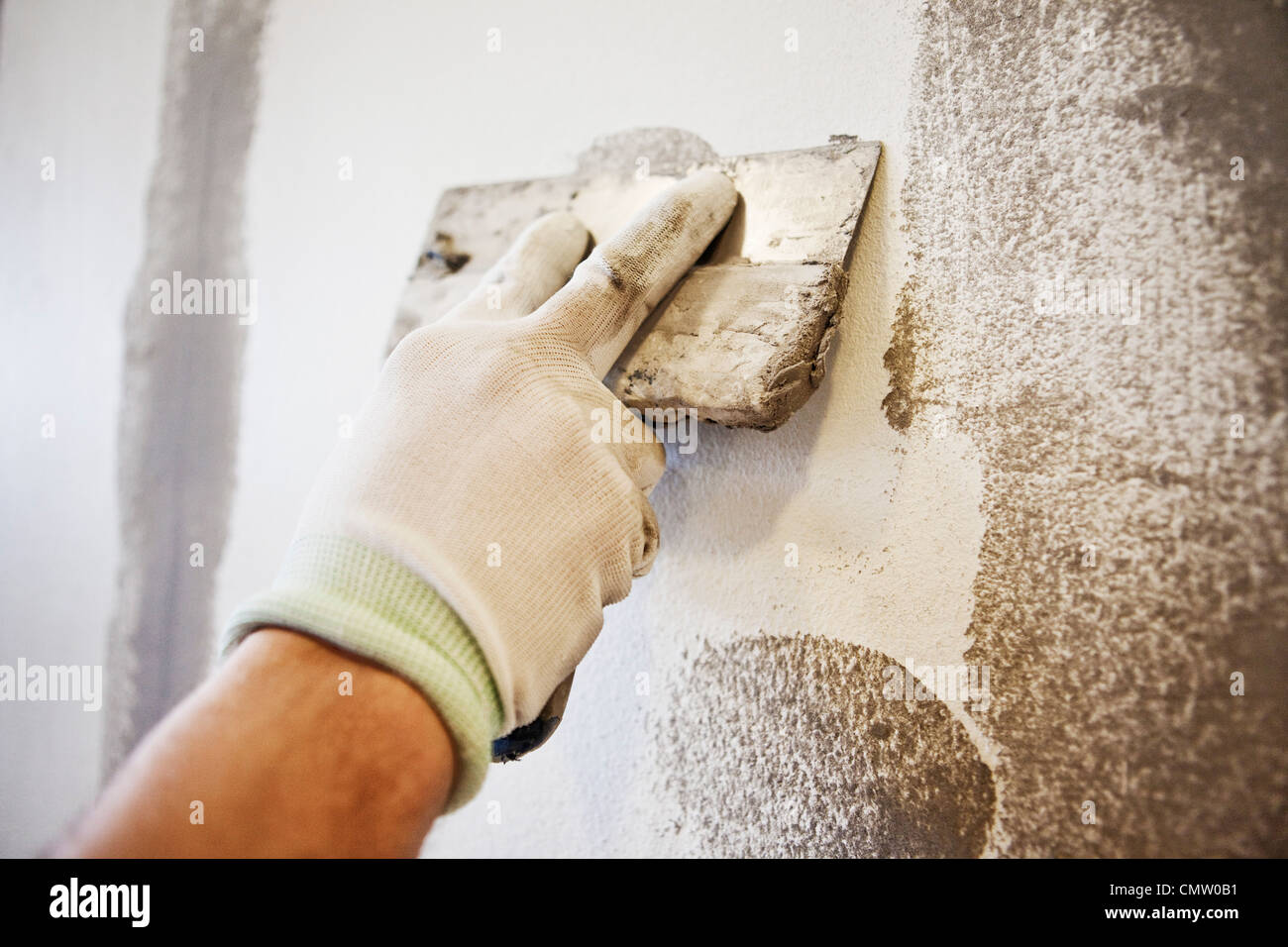 Caulking blade being used to spread filler Stock Photo