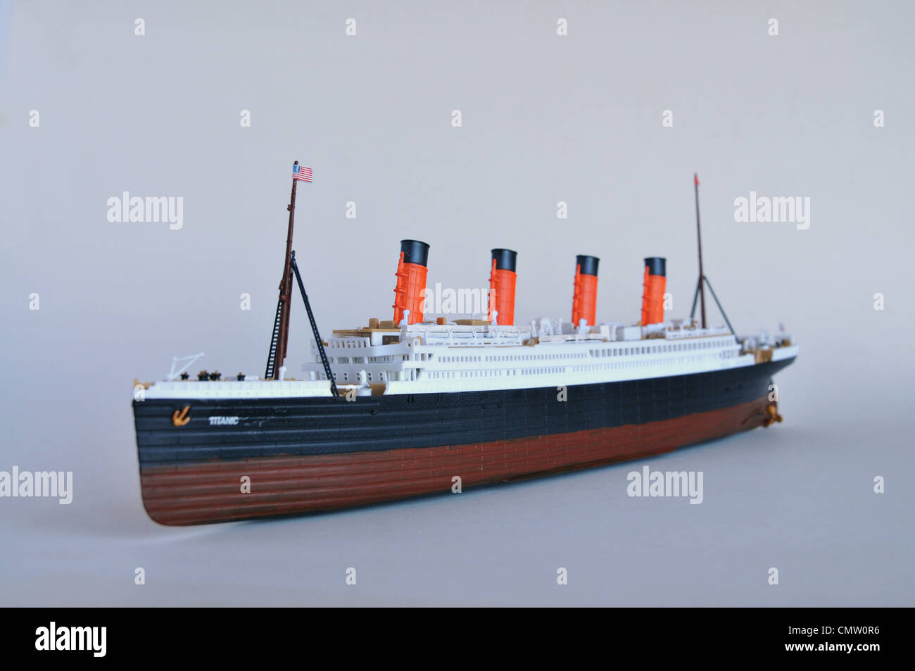Accurate replica kit model of the Titanic ship set against a blue background. Stock Photo