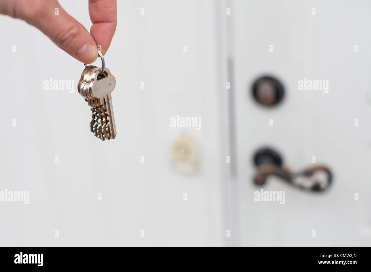 Person holding house keys Stock Photo