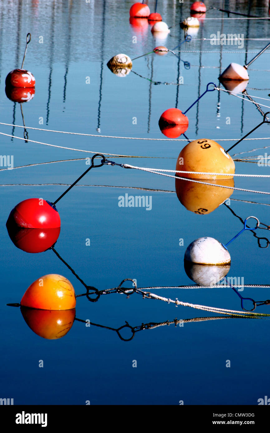 Buoys floating on water Stock Photo