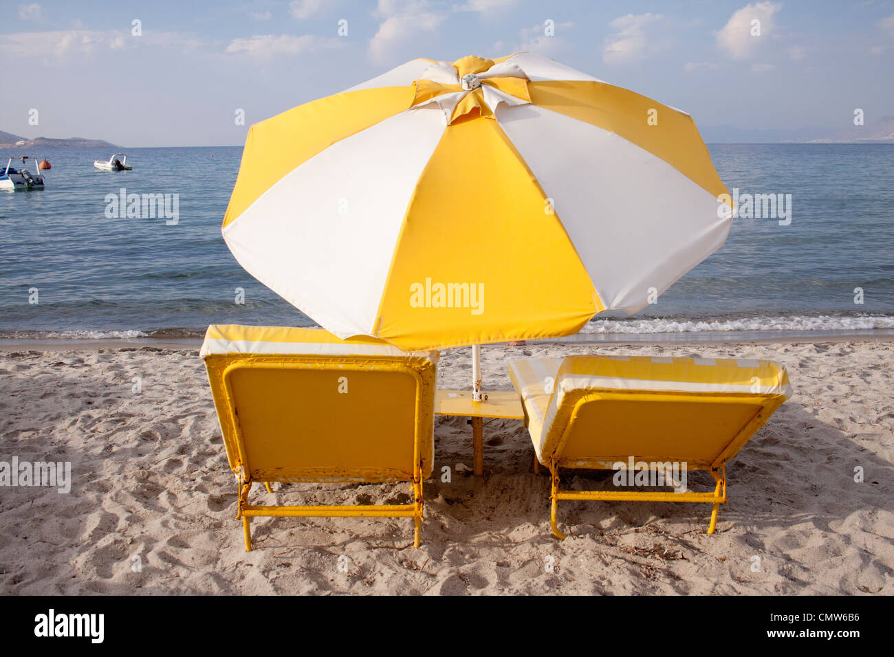 Sun loungers and parasol on Tigaki beach, kos, Greece Stock Photo