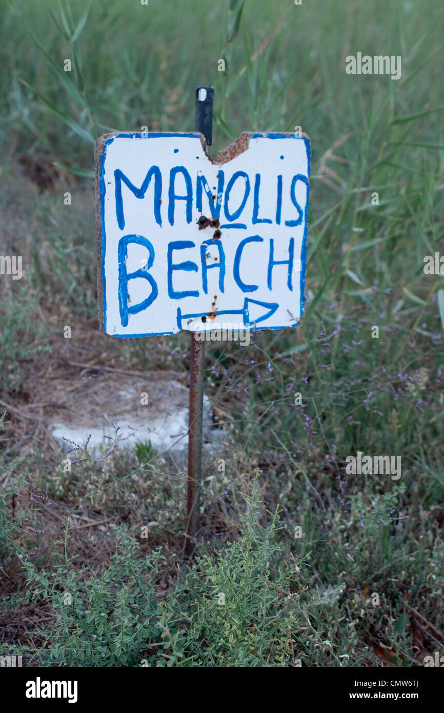 A sign pointing you in the direction of Manoli's Beach in Kos, Greece. Stock Photo