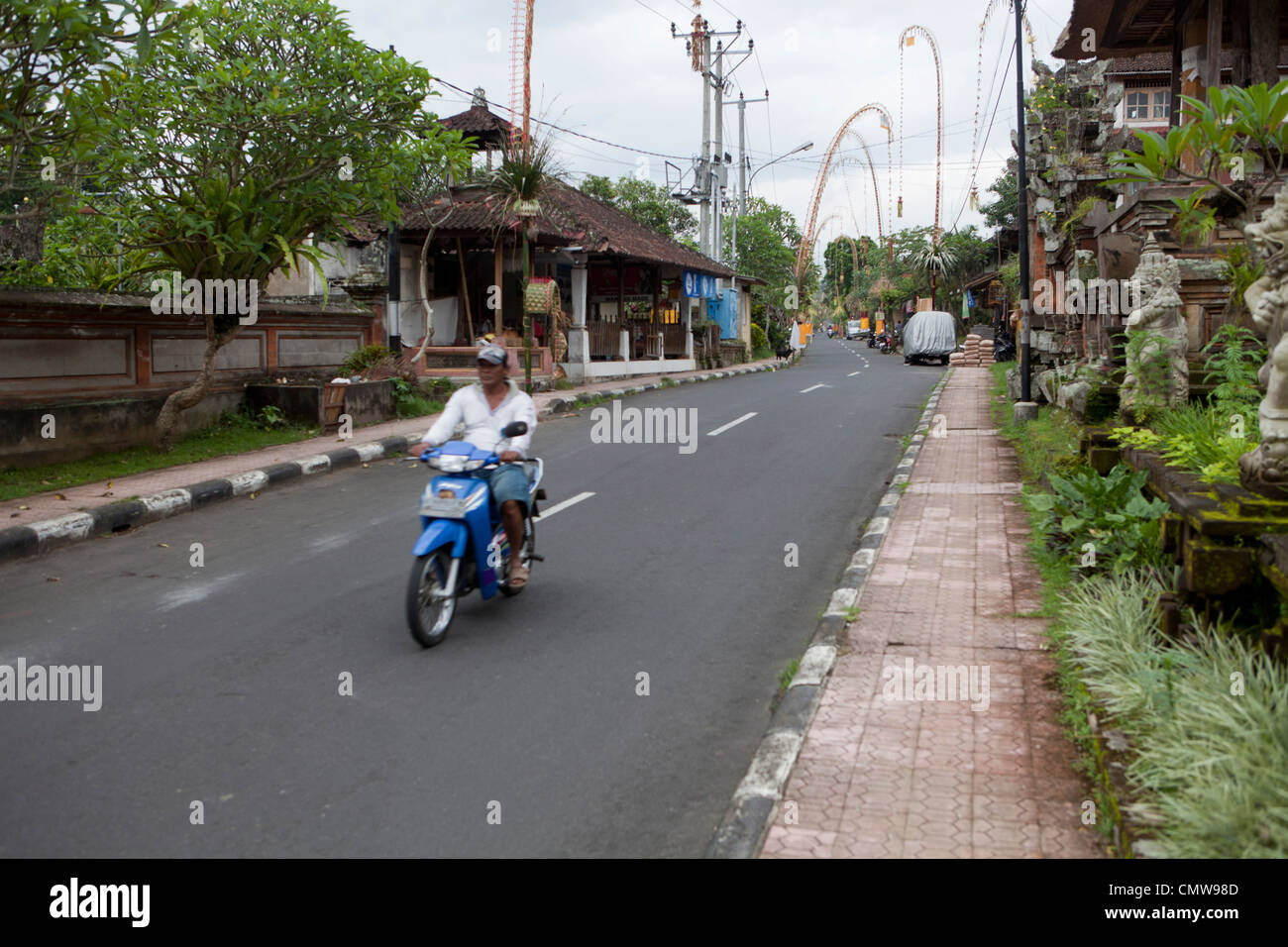 Main road in the Balinese town of Ubud, Bali, Indonesia Stock Photo