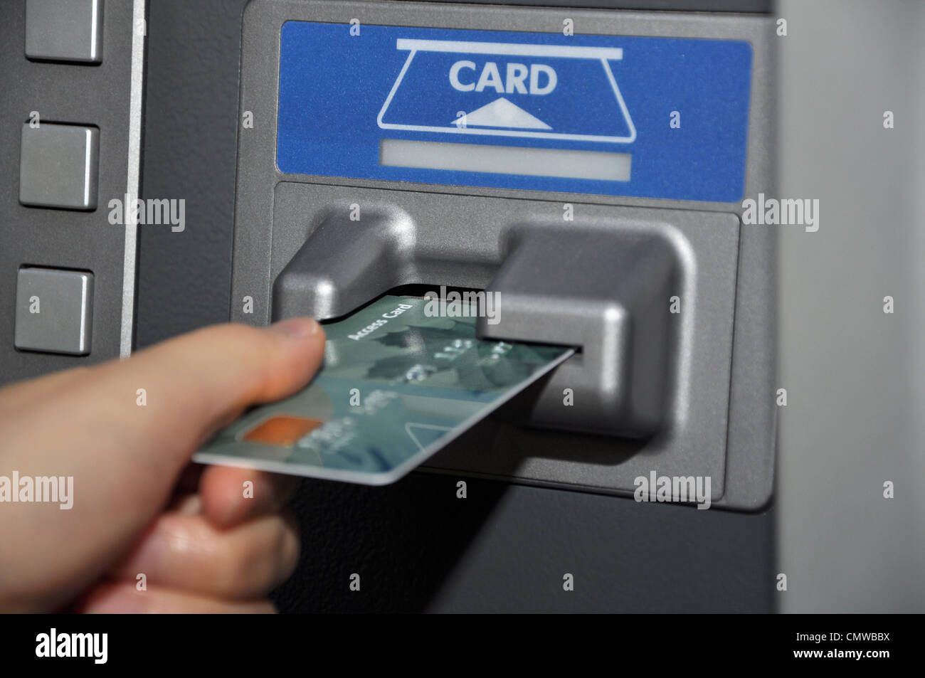 Withdraw money from ATM machine Stock Photo