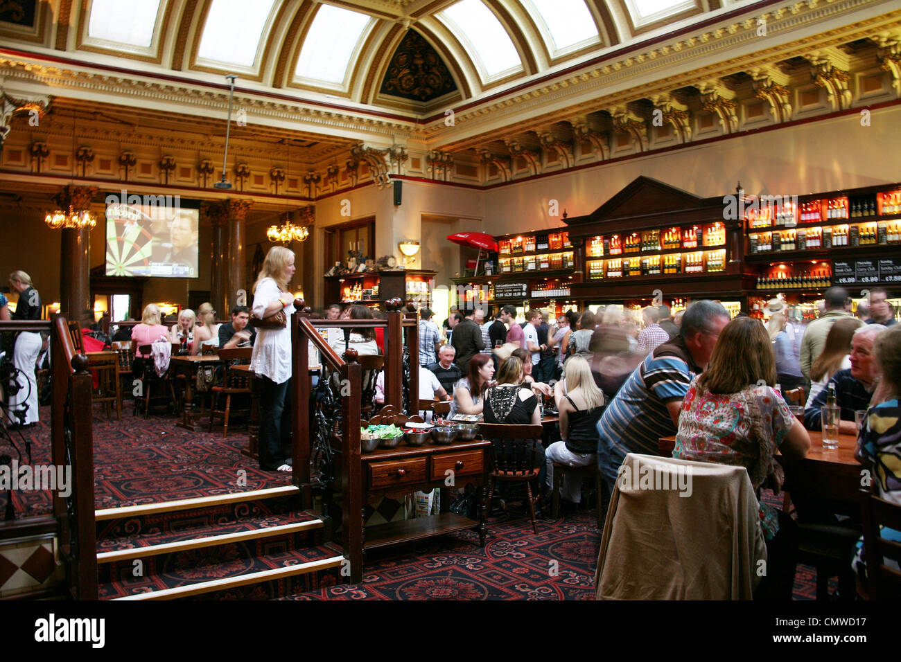 Edinburgh, UK - July 24, 2010: Inside view of a public house, known as pub, for drinking and socializing. Stock Photo