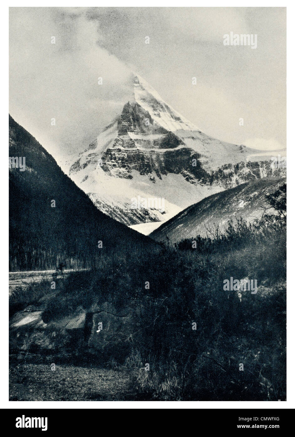 1925 Pinnacle of Mount Columbia mist mountain Stock Photo