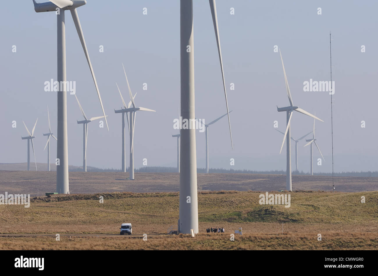 Image showing the size and scale of wind turbines and farm. There is a
