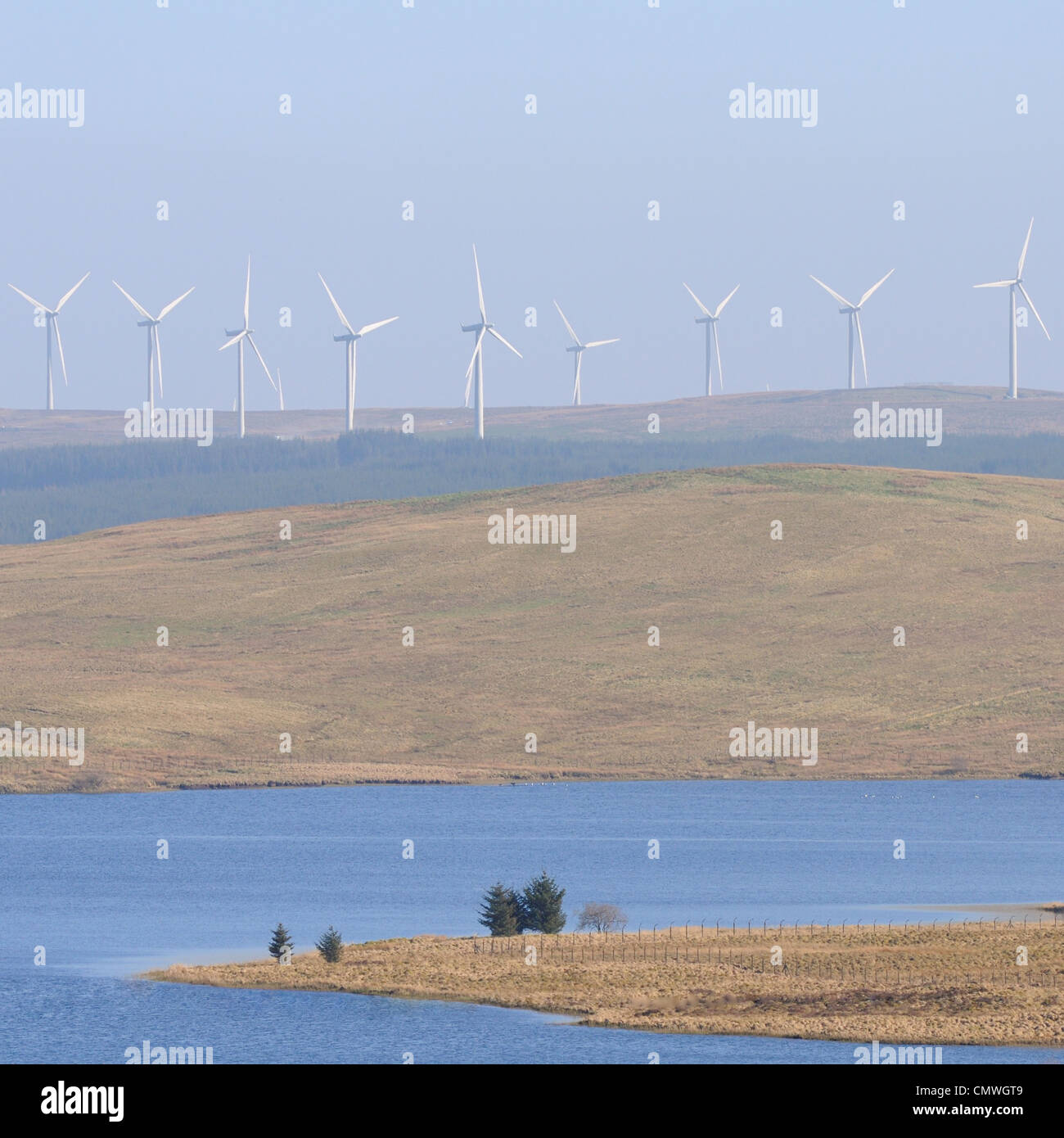 Dunwan Dam with Whitelee windfarm spreading across the moor. Stock Photo