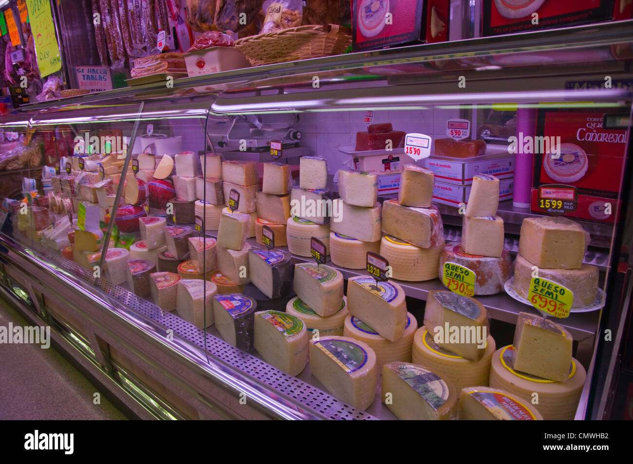 Cheese stall Guzman el Bueno market hall central Madrid Spain Europe Stock Photo